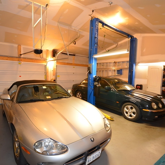 Organized garage with car lift, tool storage, and two cars - Gus from Berlin, MD