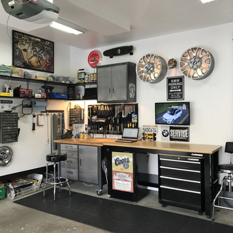 Organized garage with workbench, tool storage, and wall decor - Dave from Guelph, Ontario