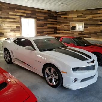 Modern garage with muscle cars and wood accent walls - Travis Moldenhauer from Appleton, Wisconsin