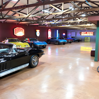 Classic Cars and Neon Garage Signs Displayed on Walls - Bob
