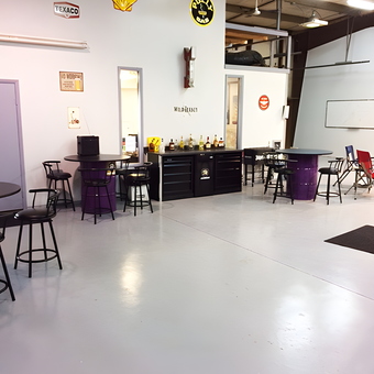 Garage Lounge with Bar Tables and Wall Signs - Ron Finney Racing from Greenwood, Indiana