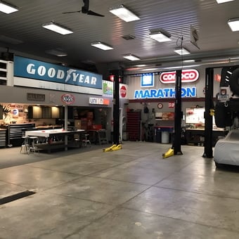 Spacious garage with lifts, workbenches, and vintage signs - Rob from Center Point, Iowa