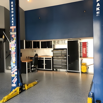 Organized garage with car lift, cabinets, and tool chest - P&J Motorsports from Parrish, Florida