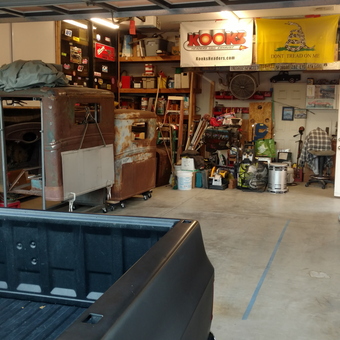 Organized garage with tool storage and vintage car project - JonnieK from Bermuda Dunes, CA