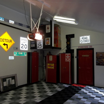 Garage with Road Signs, Cabinets, and Checkered Floor - PLY GUY from Indio, CA