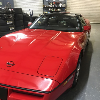 Red Corvette and Stacked Tires in Organized Garage - Bun31639 from Nashville, Ga