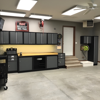 Modern garage with cabinets, workbench, and tool storage - Roger O from Center Point, IA