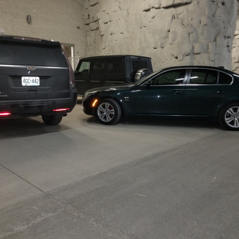 Luxury SUVs and Sedans Parked in Spacious Garage - Jason A Domina from O'Fallon, Illinois