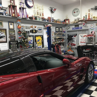 Corvette themed garage with car lift and collectibles - Dan & Janet from Pineville, La
