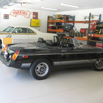 Organized garage with classic cars, shelving, and tools - 70Hurst300