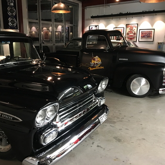 Classic Chevy Trucks in Stylish Garage with Wall Art - Mats