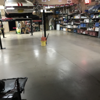 Organized garage with car lift and shelving - Ron from Las Cruces, Nm
