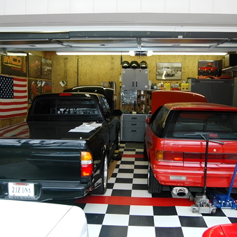 Organized garage with cars, cabinets, and tools - Derek from Purlear, North Carolina
