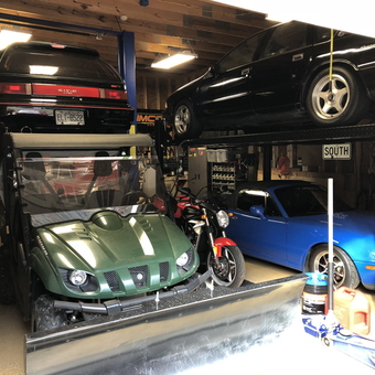 Multi-car garage with lifts, toolboxes, and vehicles - Derek from Purlear, North Carolina