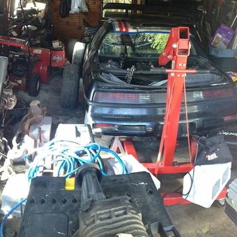 Crowded Garage with Car Parts and Engine Hoist - #1carGarageProblems from Taunton, Ma