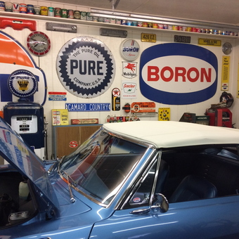 Vintage Garage Decor with Classic Signs and Blue Car - Catfish from Alexandria, Kentucky