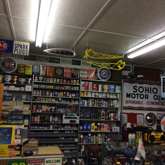 Garage with Vintage Signs, Tools, and Oil Cans - Catfish from Alexandria, Kentucky