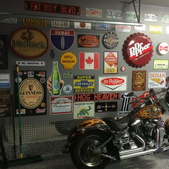 Garage Wall with Signs, License Plates, and Motorcycle - Stump from Calgary, AB