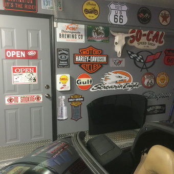 Garage Wall with Vintage Signs and Car Hood Display - Stump from Calgary, AB