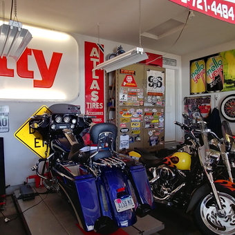 Garage with Motorcycles, Vintage Signs, and Neon Decor - Cupcake from Center Point, Ia
