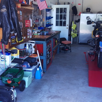 Organized garage with motorcycle lift and workbench - Shade from Murrells Inlet, South Carolina