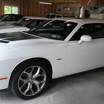 Modern white muscle cars in organized garage - Bylebyl's Garage from Amsterdam, New York