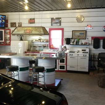 Retro Garage Kitchen With Barrels, Stove, and Decor - Kyle from Pinetown, North Carolina