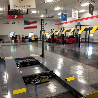 Spacious Garage with Car Lifts and Tile Flooring - Jim's Man Cave