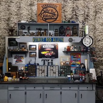 Organized garage workbench with cabinets and wall signs - Terry from Elgin, OR