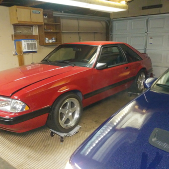 Red Mustang on Car Dollies in Organized Garage - Uncle B from Shelbyville, KY