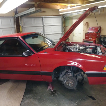 Red Mustang on Jack Stands in Garage - Uncle B from Shelbyville, KY