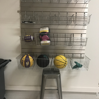Garage slatwall with wire baskets for sports storage - Jante from Bellaire, Texas