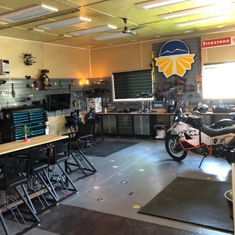 Organized garage with tool cabinets, workbenches, and motorcycle - Peter Venables from Medicine Hat, Alberta