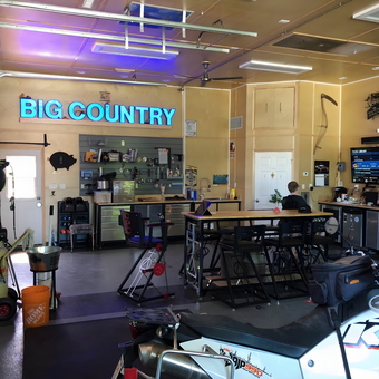Organized garage with workbench, tool storage, and KTM motorcycle - Peter Venables from Medicine Hat, Alberta