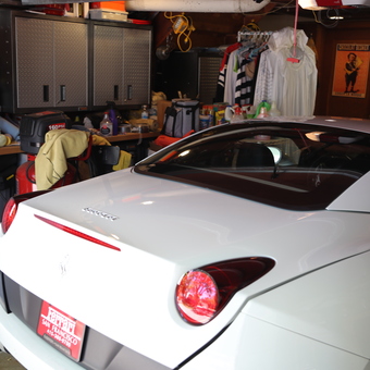 Organized garage with cabinets, tool chest, and Ferrari - RCS from San Mateo, CA