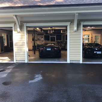 Luxury garage with black cabinets and sports cars - Tony from Fairfield, CT