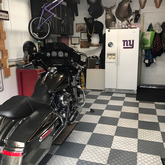 Motorcycle Garage with Tile Flooring and Wall Mounts - Vinny C Long Island NY