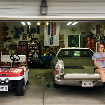 Organized garage with Ford decor and vehicles - Chris from Litchfield, Oh