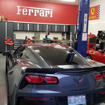 Luxury Garage with Car Lift, Cabinets, and Ferrari Decor - Mike from Joplin, Missouri