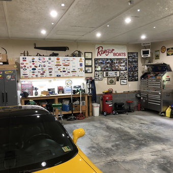Organized garage with workbench, tool chests, and yellow car - Dave from Covington, Virginia