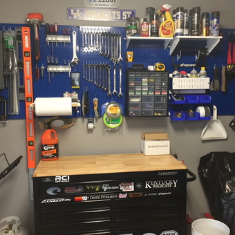 Organized garage workbench with pegboard tool storage - Brian from Louisville, KY
