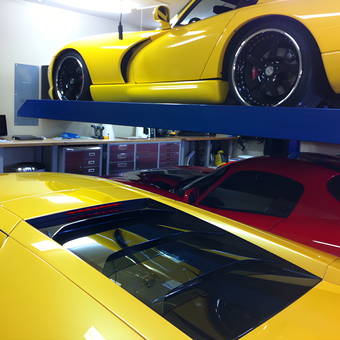 Home garage with car lift and tool cabinets - Thai from Orlando, FL