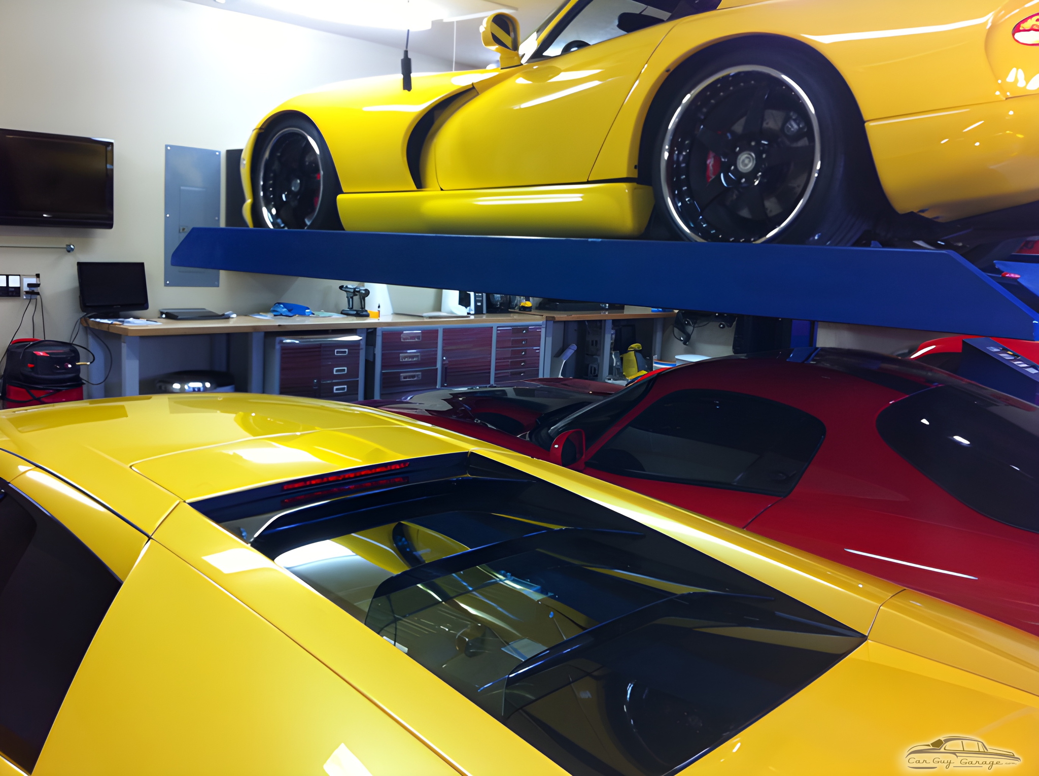 Home garage with car lift and tool cabinets - Thai from Orlando, FL