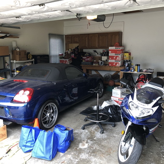 Organized garage with blue sports car and motorcycle - Troy from Racine, Wisconsin