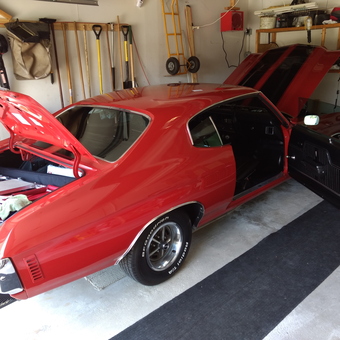 Classic red muscle car in organized garage - Dave from Tinley Park, Illinois