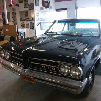 Classic GTO in Decorated Garage with Wall Signs - Patricia Persello from Canton, OH