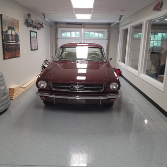 Clean epoxy garage floor with classic car wall art - Jeff from Burns, Tn