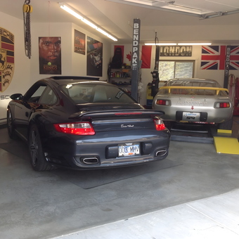 Porsche Garage with Car Lift and Wall Decor - Porsche crazy