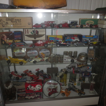 Glass display case with vintage race car collectibles - Mark from Muncie, Indiana