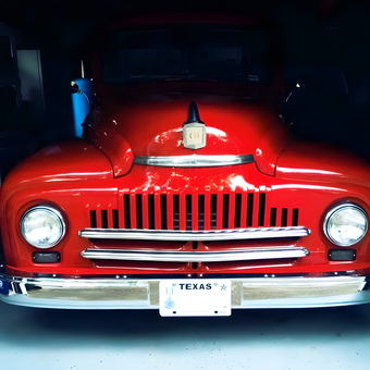 Classic Red Truck with Chrome Grille in Garage - Area66Garage from Bloomington, MN